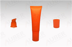 orange airless pump tube in d30mm with screw on caps for hand cream